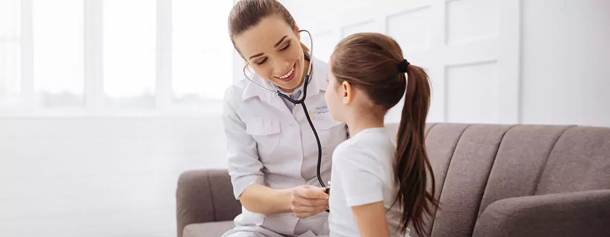 Doctor in abu dhabi doing a health checkup of young kid