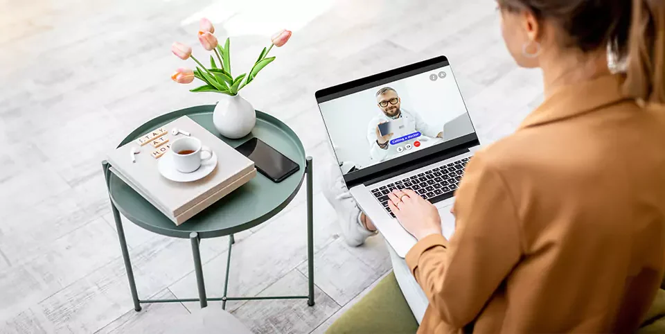 Woman Getting consulted online by a doctor in Qatar