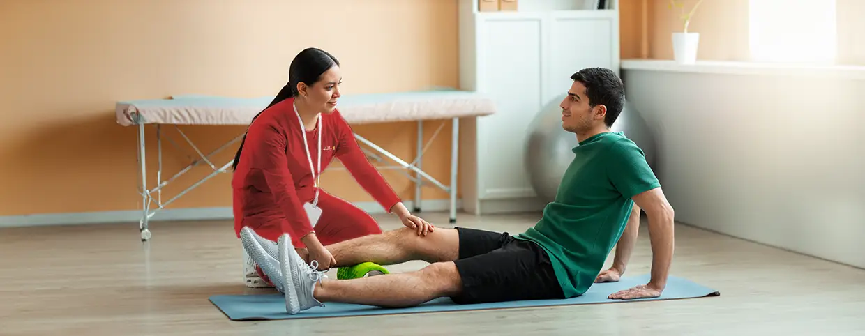 Physical therapist providing sports physiotherapy to an athlete